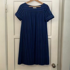 This adorable HD in Paris dress falls to the knee in cool blue stripes.